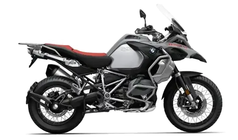 Biały motocykl BMW R 1250 GS ze złotymi felgami i czerwoną kanapą na czarnym tle – oferta wypożyczalni Motorland.rent