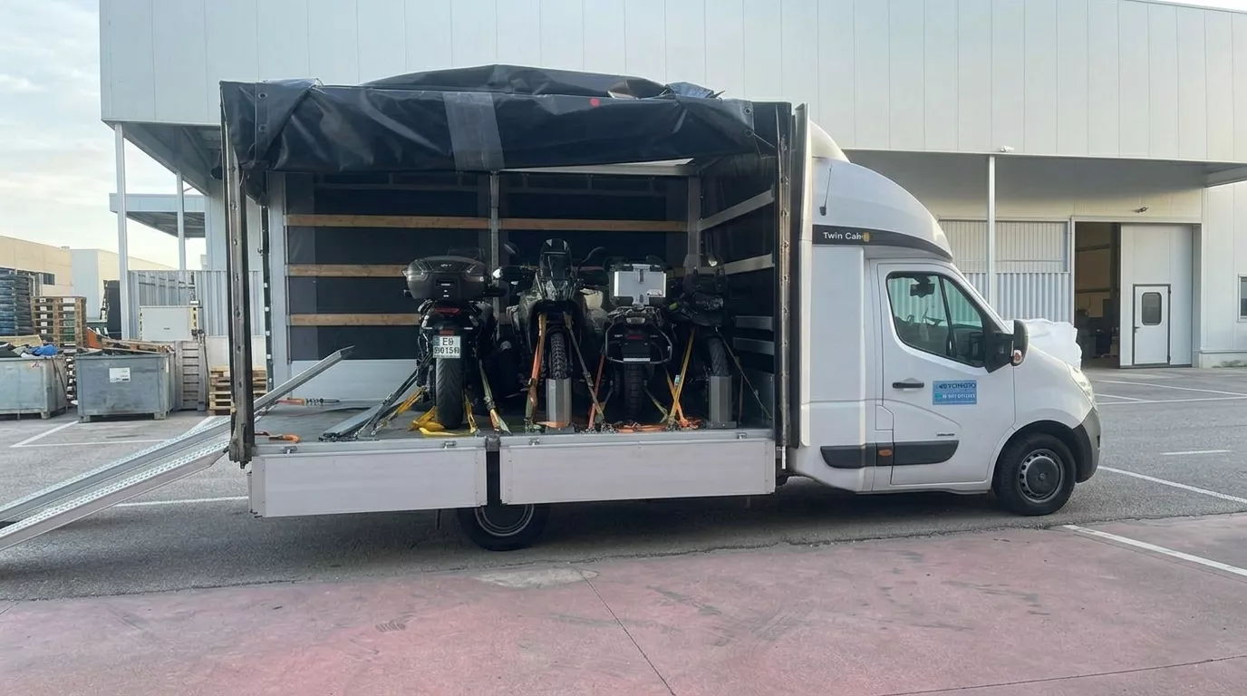 Professional motorcycle transport on a trailer in front of the Motorland.rent base in Malaga – BMW GS and Yamaha Tenere 700